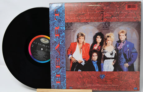 Vinyl record with cover featuring a band on a white background