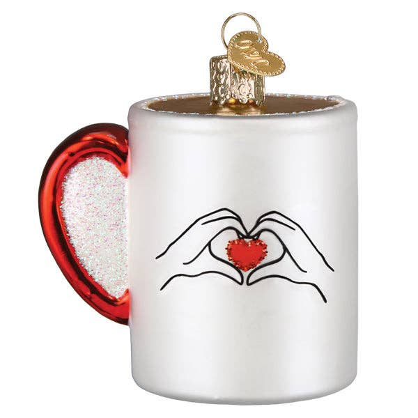 Swiftea mug ornament backside with heart hands holding a red glittery heart
