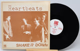 Vinyl record with 'The Heartbeats' album cover featuring a group of people.