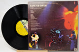 Vinyl record with a colorful album cover featuring musicians.