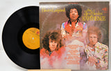 Vinyl record and cover of 'Electric Ladyland' by Jimi Hendrix Experience on a white background