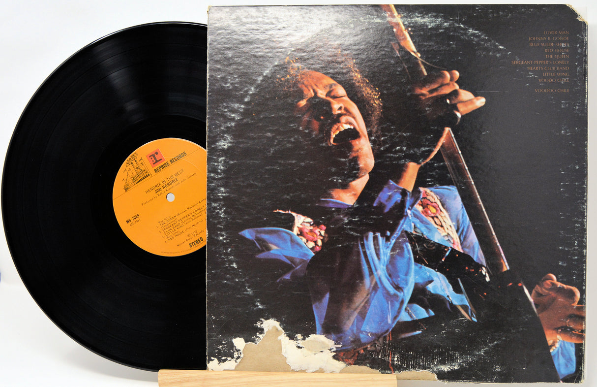 Vinyl record with a colorful cover featuring a person playing an instrument on a white background