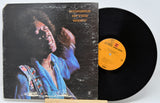 Vinyl record and cover titled 'Hendrix in the West' on a white background