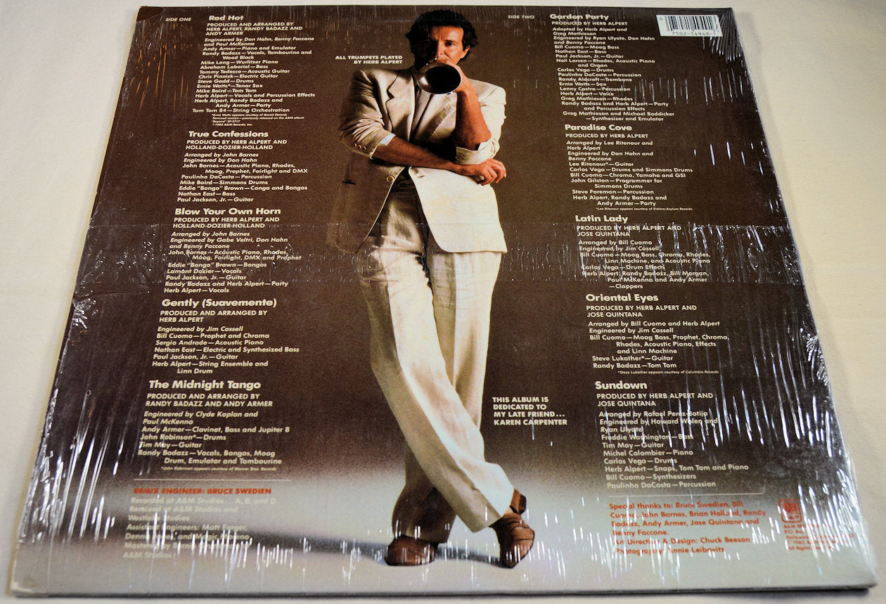 Back cover of Herb Alpert Blow Your Own Horn LP with track titles and artist photo