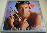 Front cover of Herb Alpert Blow Your Own Horn album featuring Herb Alpert holding trumpet