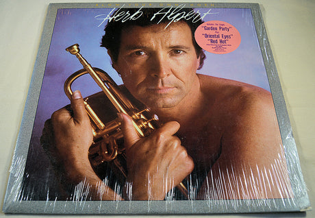Front cover of Herb Alpert Blow Your Own Horn album featuring Herb Alpert holding trumpet