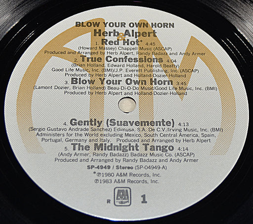 Close-up of Herb Alpert Blow Your Own Horn vinyl record label showing tracklist and credits