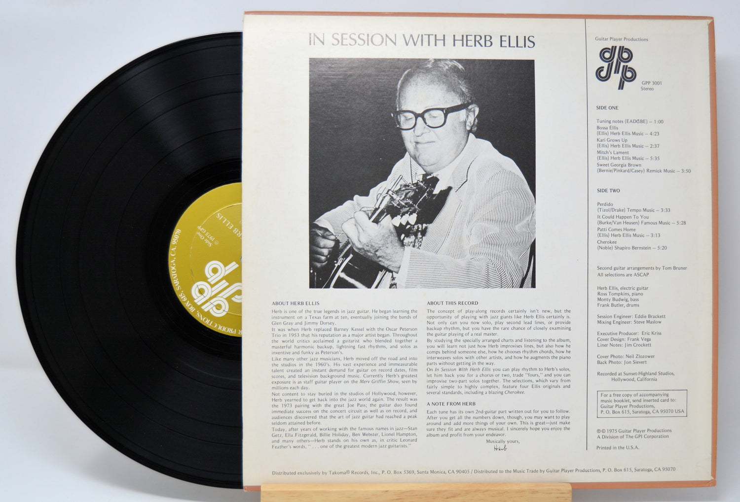 'Herb Ellis In Session With' Vinyl record with cover featuring a black and white photo of a person playing guitar and text.