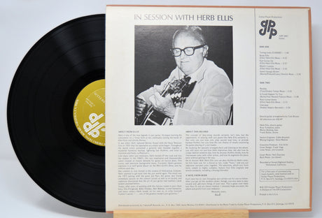 'Herb Ellis In Session With' Vinyl record with cover featuring a black and white photo of a person playing guitar and text.