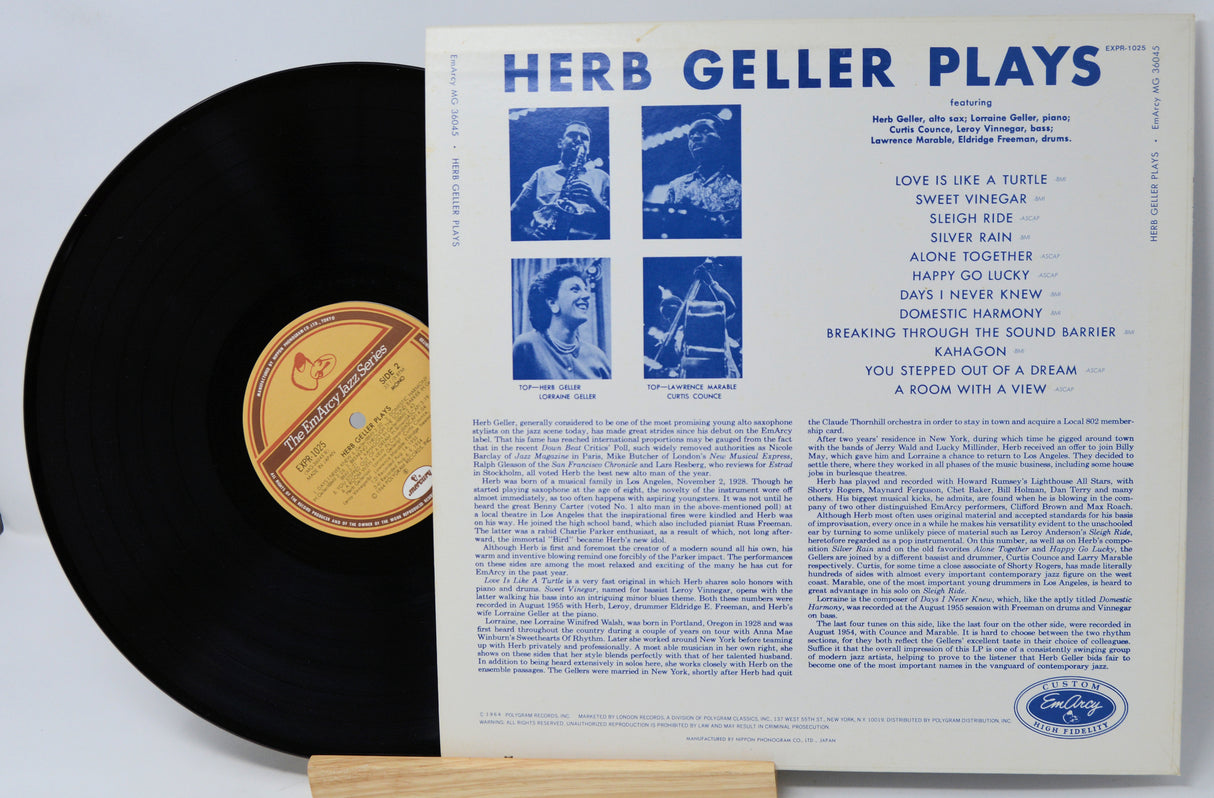 Vinyl record with its cover displaying 'Herb Geller Plays' on a white background