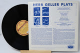 Vinyl record with its cover displaying 'Herb Geller Plays' on a white background