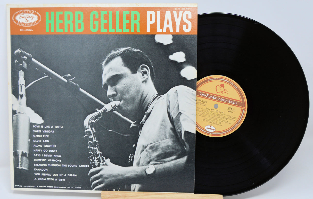 Vinyl record with cover featuring a saxophonist and text 'Herb Geller Plays'.