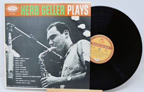 Vinyl record with cover featuring a saxophonist and text 'Herb Geller Plays'.
