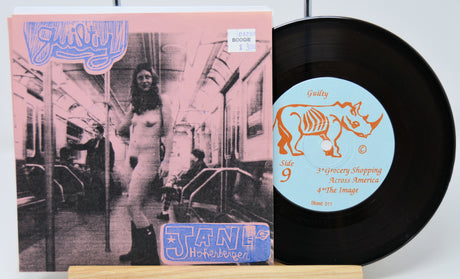 Vinyl record with cover featuring a person on a subway and a rhino illustration on the label.
