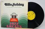 Billie Holiday 'Jazz Greats' vinyl record LP with the album cover on the left and the black record partially pulled out on the right, set against a plain light background.