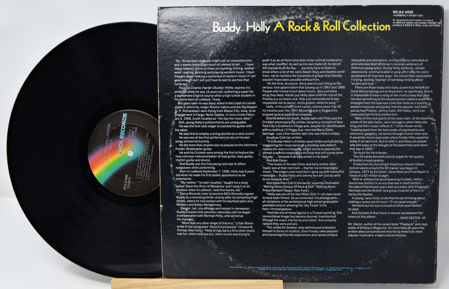 Vinyl record with rainbow label and text on the back cover