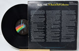 Vinyl record with rainbow label and text on the back cover