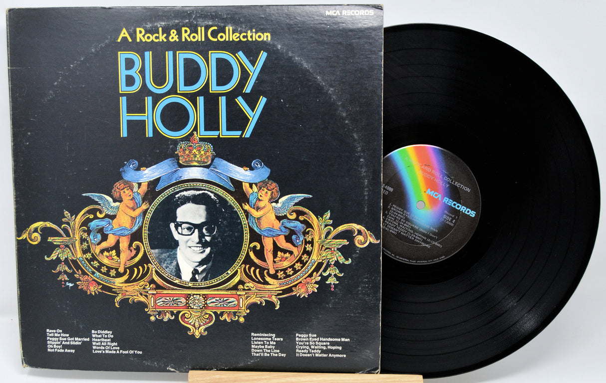 Vinyl record and cover of 'A Rock & Roll Collection' by Buddy Holly on a white background