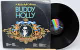 Vinyl record and cover of 'A Rock & Roll Collection' by Buddy Holly on a white background