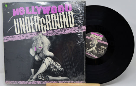 Front cover of Hollywood Underground vinyl LP with 80s glam rock model and bold title design