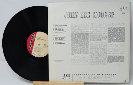 Vinyl record with cover featuring 'John Lee Hooker' on a white background