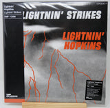 Lightnin' Hopkins 'Lightnin' Strikes' vinyl record album cover, VMP Classics catalog CRO0477, shown in shrink wrap on a wooden display stand.