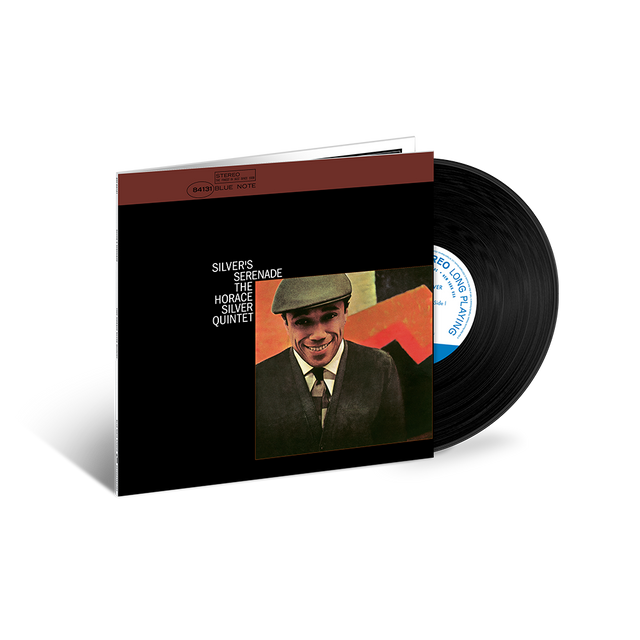 Vinyl record and cover with a man's portrait on a black background