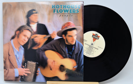 Vinyl record with 'Hothouse Flowers' album cover featuring band members.