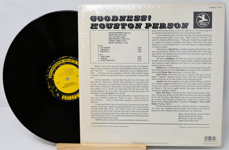 Vinyl record with its cover displaying text and a logo.
