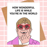 Birthday card with illustration of a singer in red polka dot glasses and the quote 'How wonderful life is while you’re in the world.'
