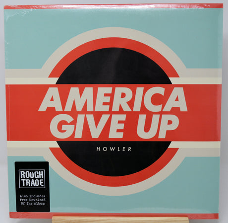 Vinyl record cover for 'America Give Up' by Howler with a red and blue design.