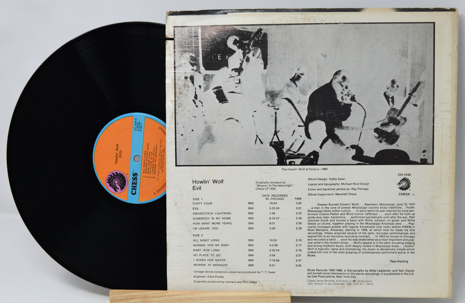 Vinyl record with a black cover and orange label, featuring a jazz band illustration on the back.