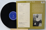 Vinyl record with cover featuring a photo of Howlin' Wolf and album details.