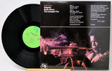 Vinyl record and its cover featuring a person with a rifle and smoke, with 'Red Clay' and 'Delphiia Suite Sioux' text.