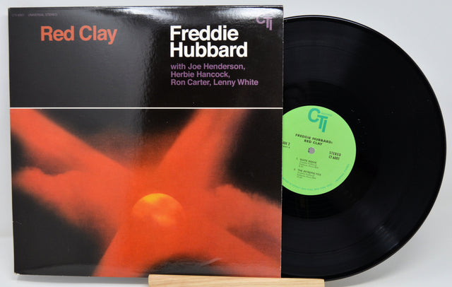 Vinyl record with cover featuring 'Red Clay' by Freddie Hubbard on a white background