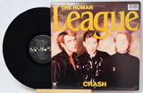 Vinyl record and cover of 'The Human League' album 'Crash' on a white background