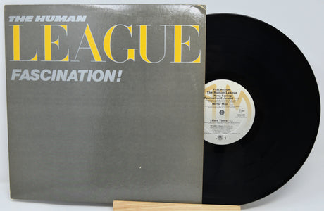 Vinyl record with 'The Human League' album 'Fascination!' on a white background