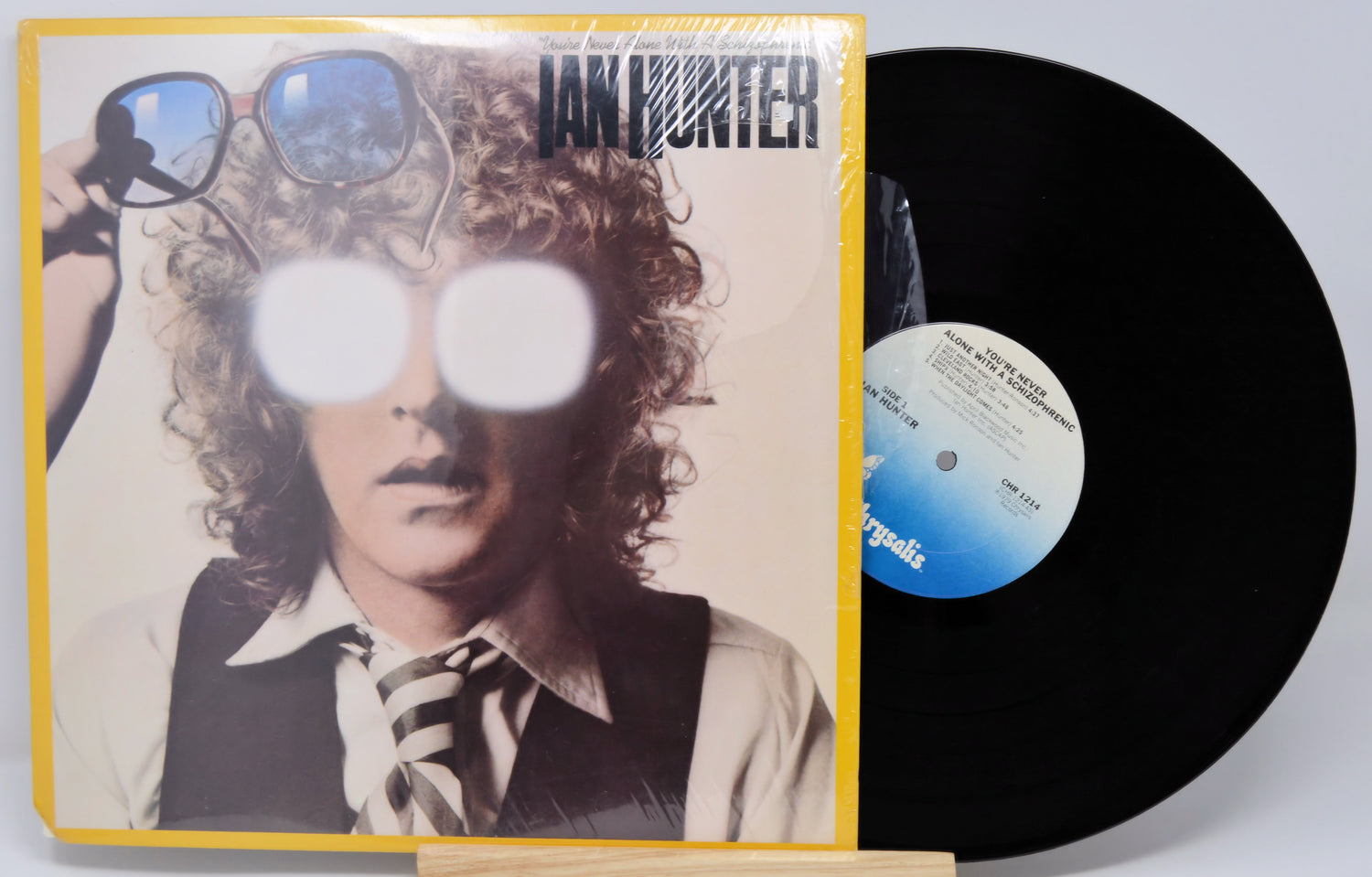 Vinyl record with cover featuring a person with sunglasses and text 'Ian Hunter'.