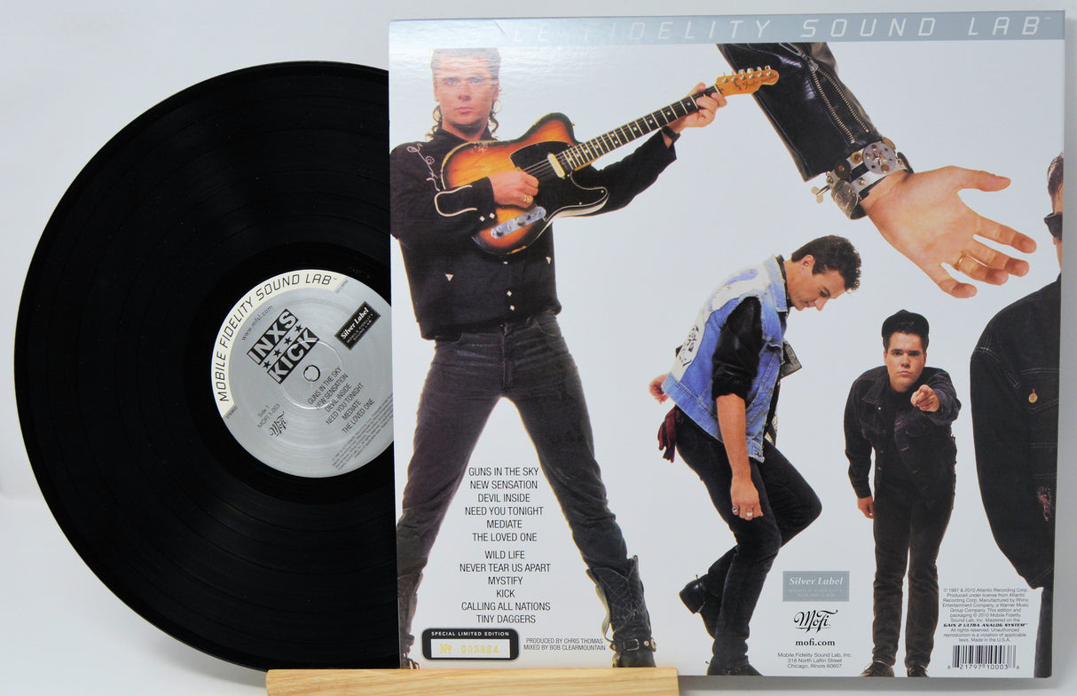 A vinyl record and its back cover from the album 'Weird Al Yankovic: Weird Sound Lab' displayed on a small wooden stand against a white background.