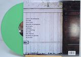 Back cover of I Rise 'For Redemption' green vinyl LP showing tracklist and rustic door
