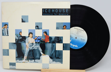 Vinyl record with cover featuring a collage of people and 'Icehouse' album text.
