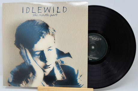 Front cover and vinyl of Idlewild The Remote Part featuring iconic album art