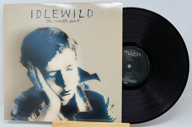 Front cover and vinyl of Idlewild The Remote Part featuring iconic album art