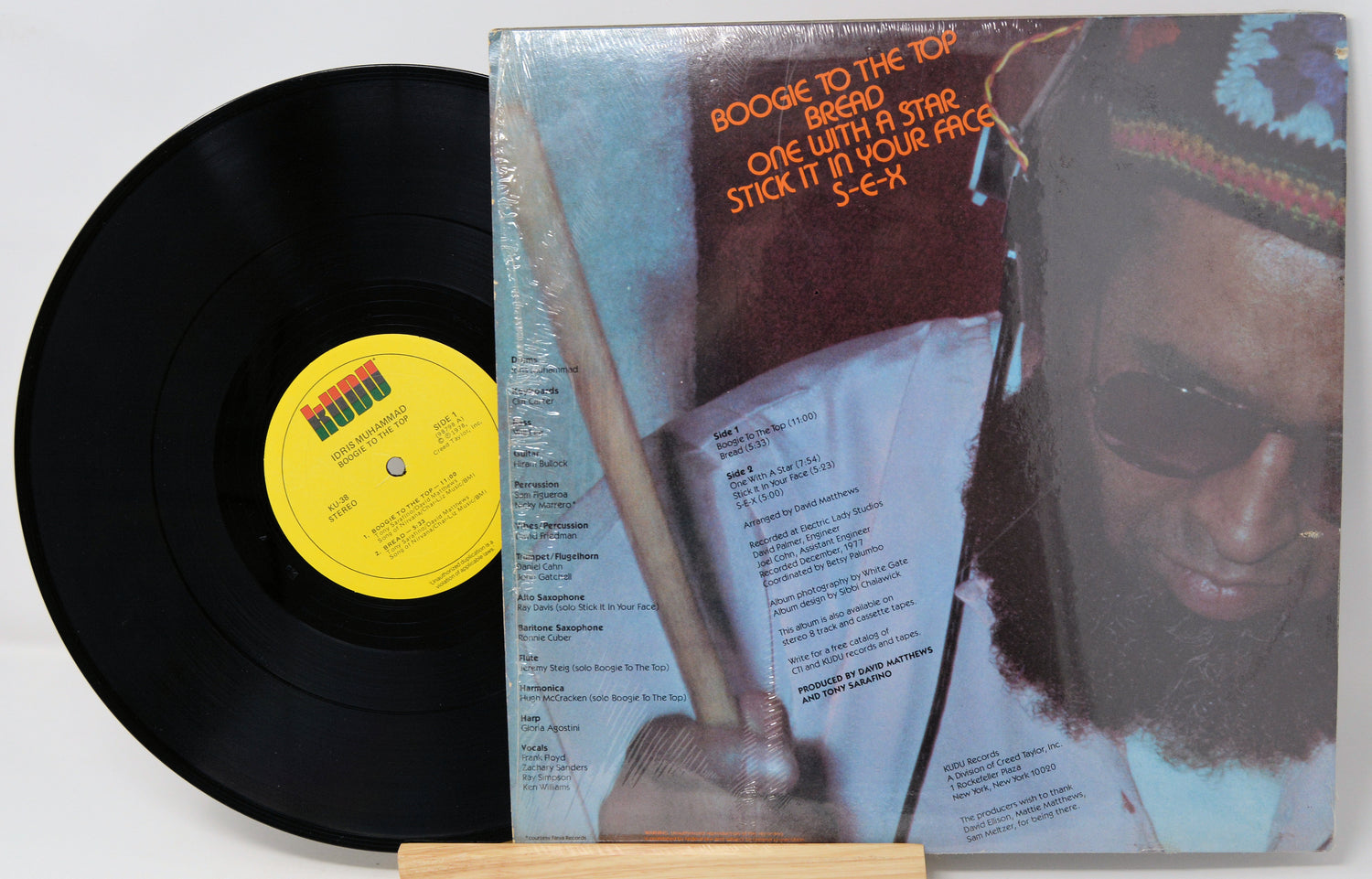 Vinyl record with a colorful cover featuring a person and text.