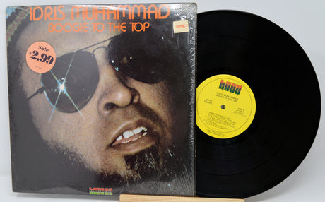 Vinyl record with a cover featuring a person with a eyepatch on a white background
