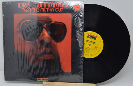 Vinyl record with cover featuring a person wearing sunglasses and text 'Idris Muhammad Turn This Mutha Out'.