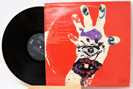 Vinyl record with a colorful hand design on the cover