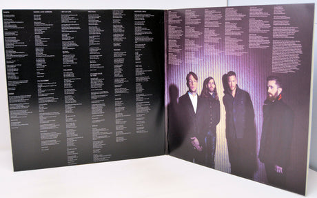 Vinyl record with cover featuring a black and white portrait and album title.