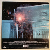 Vinyl record back cover with emergency warning and explosion of sparks at night