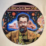 Psychedelic picture disc featuring a bearded man with animal heads and vibrant symbols